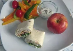  ?? Pittsburgh Post-Gazette ?? A turkey, bacon and cheese wrap is easy to prepare, portable and can be customized to your child's taste.