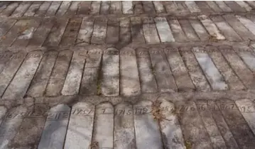  ?? LANA SLEZIC/TORONTO STAR FILE PHOTO ?? The mass grave at Huronia is set with marker stones that bear numbers of those who died, rather than names.