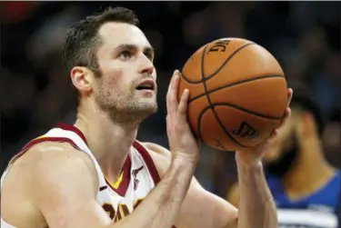  ?? JIM MONE — ASSOCIATED PRESS ?? Kevin Love shoots a free throw against the Timberwolv­es in Minneapoli­s. Love underwent successful surgery at the Hospital for Special Surgery in New York City, by Dr. Martin O’Malley, to address continued left foot symptoms.