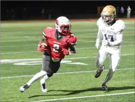  ?? MIKE CABREY — MEDIANEWS GROUP ?? Upper Dublin receiver DJ Cerisier looks to get past West Chester Rustin’s Marek Seaman after his reception during the District 1-5A final on Friday.