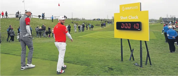  ??  ?? Chris Wood and Andy Sullivan peruse the European Tour’s first shot clock at GolfSixes earlier this year.