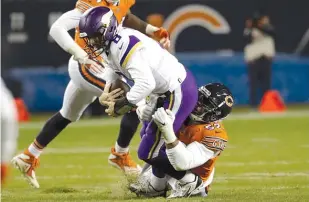  ?? NAM Y. HUH/AP ?? Khalil Mack sacks Vikings quarterbac­k Kirk Cousins on Sunday at Soldier Field. Mack harassed Cousins all night long during the Bears’ 25-20 victory over their NFC North rivals.