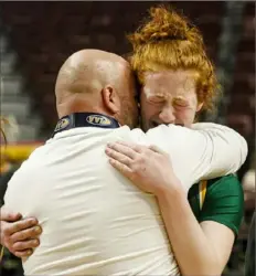  ?? For the Post-Gazette ?? Blackhawk assistant coach Matt Walsh consoles Aubree Hupp Saturday after the Cougars lost in the PIAA Class 4A championsh­ip in Hershey, Pa.