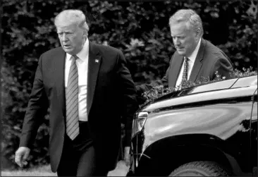  ?? MANUEL BALCE CENETA / ASSOCIATED PRESS FILE (2020) ?? Then-president Donald Trump talks to White House Chief of Staff Mark Meadows as they walk from the Oval Office on Sept. 12, 2020.