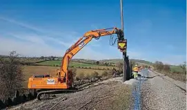  ??  ?? Work on the landslip, seen underway on March 23, has now been halted because of the coronaviru­s pandemic. JONATHAN TAYLOR/G/WR