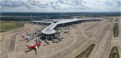  ?? Photo: Xinhua/Pu Xiaoxu ?? This aerial photo taken on Nov. 20, 2021 shows the expansion project of Haikou Meilan Internatio­nal Airport in Haikou, south China’s Hainan Province.