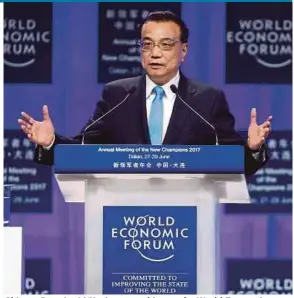  ?? REUTERS PIC ?? Chinese Premier Li Keqiang speaking at the World Economic Forum in Dalian, China, yesterday.