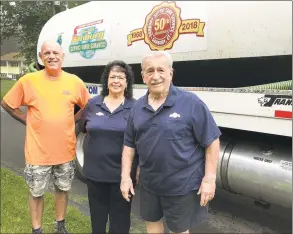  ?? Chris Bosak / Hearst Connecticu­t Media ?? Richard Chiarella II, Carole Chiarella and Richard Chiarella at their Danbury Septic Tank Service truck at the company’s home office in Danbury on Friday.