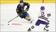  ?? David Zalubowski / Associated Press ?? Quinnipiac forward Odeen Tufto, left, looks to pass as Minnesota State defenseman Akito Hirose defends in the second period of an NCAA West Regional semifinal.