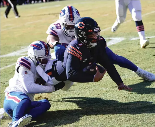  ?? CHARLES REX ARBOGAST/AP ?? While the Bills kept Justin Fields in check, the Bears’ running game withered, totaling just 80 yards on 29 carries (2.8 average).