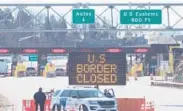  ?? LARS HAGBERG/AFP ?? A sign says that the border is closed at the U.S.-Canada border in March in Lansdowne, Ontario.