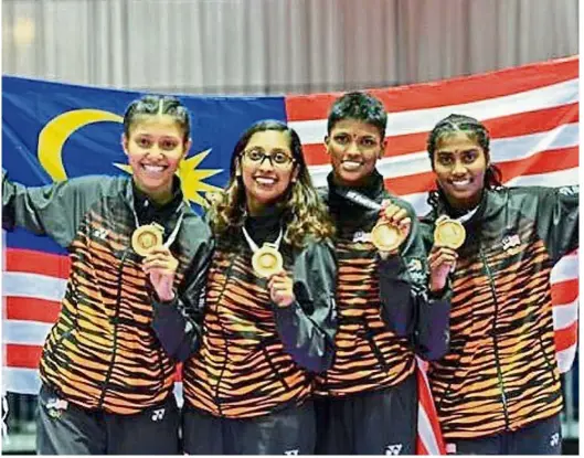  ??  ?? Happy bunch: (from left) Syakilla Salni Jefry Krisnan, M. Mathivani, S. Shree Sharmini and P. Madhuri posing with their gold medals at the Kuala Lumpur SEA Games in 2017.