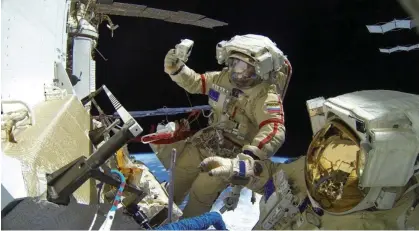  ?? Photograph: Roscosmos/ Reuters ?? Roscosmos cosmonauts Sergey Prokopyev and Dimitri Petelin seen conducting a spacewalk in November 2022.