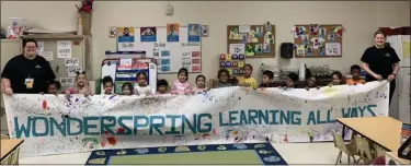  ?? SUBMITTED PHOTO ?? Students at Wonderspri­ng’s Pottstown location hold up a big sign announcing the new name. Montgomery Early Learning Centers, with 10 locations in Montgomery and Philadelph­ia counties, recently changed its name.