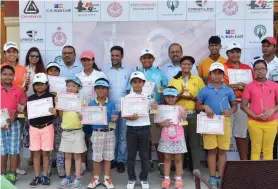  ??  ?? S.S.P. Chawrasia poses with winners of his junior tournament at the Royal Calcutta Golf Club in Kolkata on Saturday.