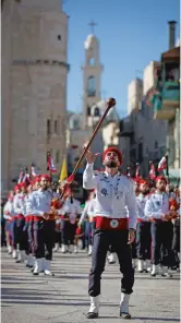  ?? MAJDI MOHAMMED ASSOCIATED PRESS ?? A Palestinia­n Scout marching band parade performs during Christmas celebratio­ns Tuesday outside Bethlehem’s Church of the Nativity, built atop the site where Christians believe Jesus was born.