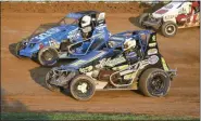  ?? CARL HESS — FOR MEDIANEWS GROUP ?? Tim Buckwalter (#52) and Billy Pauch, Jr. (#72) battle for the lead during the early stages of the 75 lap Dick Tobias Memorial race. Buckwalter emerged with the win but it was Pauch, Jr. who took the honors in the second SpeedSTR main later in the night.