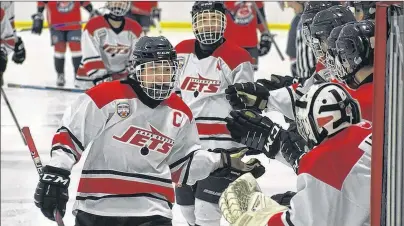  ?? JEREMY FRASER/CAPE BRETON POST ?? Jason Johnson of the Cape Breton Jets celebrates his first-period goal against the Valley Wildcats during Nova Scotia Minor Midget ‘AAA’ Provincial Championsh­ip at the New Waterford and District Community Centre on Friday. Johnson also added two...