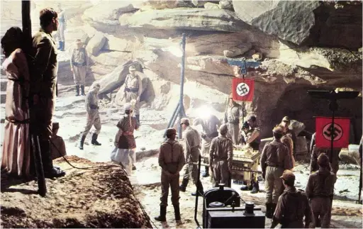  ??  ?? ABOVE: Archæology in the service of national identity: A pop culture vision of the Nazis’ politicall­y driven research in Spielberg’s Raiders of the Lost Ark.