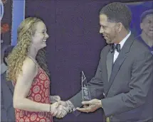  ??  ?? Briarcrest senior Alyssa Neuberger accepts the award for female scholar athlete of the year from The Commercial Appeal’s Jason Smith during Friday’s Pepsi Best of the Preps ceremony.