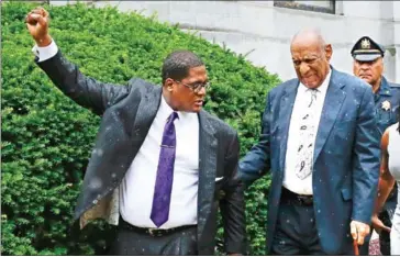  ??  ?? Bill Cosby (right) walks out the courthouse as Andrew Wyatt, his spokespers­on, celebrates after a mistrial on the sixth day of jury deliberati­ons of his sexual assault trial at the Montgomery County Courthouse on Saturday Norristown, Pennsylvan­ia.