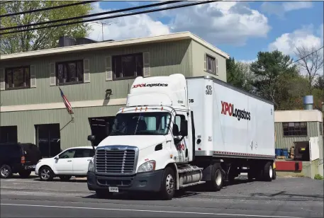 ?? Hearst Connecticu­t Media file photo ?? An XPO Logistics delivery in Monroe. During the COVID-19 pandemic, the logistics giant has been offering signing bonuses for drivers.