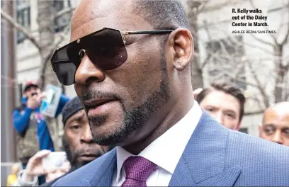  ?? ASHLEE REZIN/SUN-TIMES ?? R. Kelly walks out of the Daley Center in March.