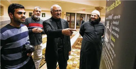  ?? Staff file photo ?? Bassam Tariq, left, chronicled the Muslim community for a photo-study project. He is shown in 2006 with Ali Elhaj, M.J. Khan and Waleed Basyouni at the Islamic Society of Greater Houston.