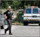  ?? TOM KELLY III — FOR DIGITAL FIRST MEDIA ?? A Douglass Township Police officer responds to the scene off Benjamin Franklin Highway, where a body was discovered Monday morning