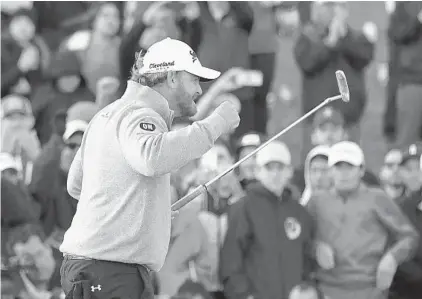  ??  ?? J.B. Holmes, who closed with a 1-under 70, reacts after winning the Genesis Open at Riviera Country Club in Los Angeles on Sunday for his first victory in three years. He rallied from four shots back in the final round while playing 34 holes on the day.