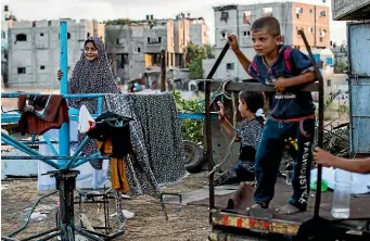  ?? AP ?? Palestinia­n refugee kids play outside their home in the northern Gaza Strip town of Beit Lahiya.