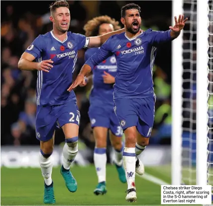  ??  ?? Chelsea striker Diego Costa, right, after scoring in the 5-0 hammering of Everton last night