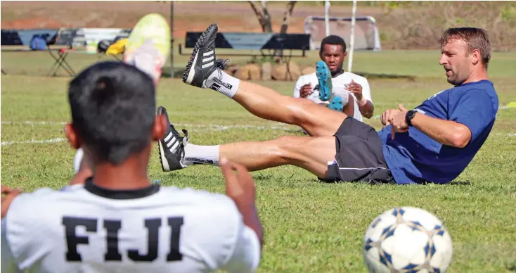  ?? Fiji FA Media ?? Fiji Football Associatio­n technical director, Timo Jankowski, takes the players through their training drills at the Fiji FA Academy in Ba on October 11, 2021. Photo: