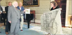  ?? Photograph­y) (Photo: Maxwell ?? Dolores Lyne displaying some of her work from the exhibition ‘To The Letter’ that debuted in Fermoy, for President Michael D Higgins.