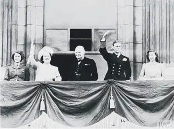  ??  ?? The Royal Family joined by PM Winston Churchill on the balcony of Buckingham Palace on VE Day (©IWM MH 21835)