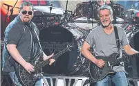  ?? ETHAN MILLER TRIBUNE NEWS SERVICE FILE PHOTO ?? Wolfgang Van Halen, left, and his father, Eddie, of Van Halen perform in 2015. Wolfgang, along with his uncle, have overseen the Van Halen catalog since Eddie’s death last October.