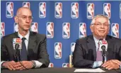  ?? ASSOCIATED PRESS ?? NBA Commission­er David Stern (right) and deputy Adam Silver announce the end of the lockout.