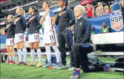  ?? GETTY IMAGES ?? Megan Rapinoe kneels during the national anthem prior to an internatio­nal match in 2016. n