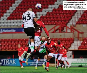  ?? Tom Sandberg/PPAUK ?? > Oscar Halls scores for Plymouth Argyle in their win at Swindon Town