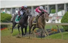  ?? AP PHOTO/JULIO CORTEZ ?? Flavien Prat atop Rombauer, right, breaks away from Irad Ortiz Jr. atop Midnight Bourbon moments before crossing the finish line to win the Preakness Stakes at Pimlico Race Course on Saturday in Baltimore.