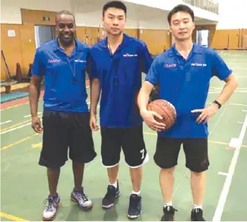  ??  ?? Dozva (left) with fellow Chinese coaches in Beijing.