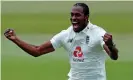  ??  ?? Jofra Archer celebrates after trapping West Indies’ Shamarh Brooks lbw for a duck. The fast bowler produced fiery spells to keep England in the game. Photograph: Adrian Dennis/AFP/Getty Images