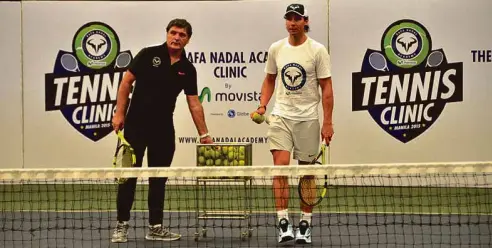  ??  ?? World Champion tennis player Rafa Nadal together with his uncle and coach Toni Nadal training the kids at the by-invitation Rafa Nadal Tennis Academy clinic at Colegio de San Agustin in Makati