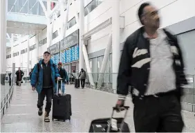  ?? CHRIS YOUNG THE CANADIAN PRESS FILE PHOTO ?? Passengers arrive at Pearson Airport in Mississaug­a earlier this month.
The number of air passenger complaints to Canada’s transport regulator has more than tripled over the past year.