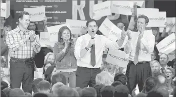  ??  ?? US Republican presidenti­al candidate Senator Marco Rubio speaks as endorsers Senator Rick Santorum (left), New Mexico Governor Susana Martinez and Kansas Governor Sam Brownback (right) applaud during a campaign rally at the Overland Park Marriott Ballroom in Overland Park, Kansas. — Reuters photo