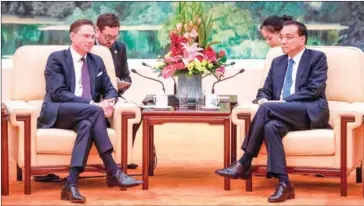  ?? FRED DUFOUR/AFP ?? European Commission Vice President Jyrki Katainen (left) attends a meeting with China’s Premier Li Keqiang at the Great Hall of the People in Beijing on Monday.