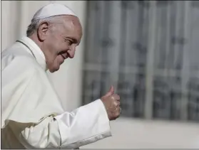  ??  ?? Pope Francis gives his thumb up at the end of his weekly general audience in St. Peter’s Square at the Vatican on Wednesday. AP PHOTO/FABIO FRUSTACI