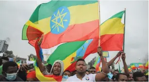  ?? (Tiksa Negeri/Reuters) ?? ETHIOPIANS WAVE their flags at a pro-government rally to celebrate the second filling of the Grand Ethiopian Renaissanc­e Dam, being built on the Nile River, and to condemn the Tigray People Liberation Front, at the Meskel Square in Addis Ababa yesterday.