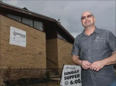  ?? ERIC BONZAR — THE MORNING JOURNAL ?? Ministries Director Mark Jones discusses the future plans of Lighthouse Ministries of Lorain while standing outside of the facility Feb. 20.