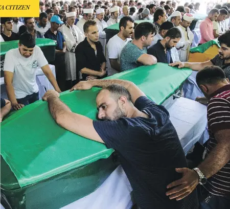  ?? ILYAS AKENGIN / AFP / GETTY IMAGES ?? People mourn during a funeral for victims of an attack on a wedding celebratio­n Saturday that left more than 50 dead in Gaziantep, Turkey, near the Syrian border. Turkish President Recep Tayyip Erdogan said the Islamic State group was the “likely...